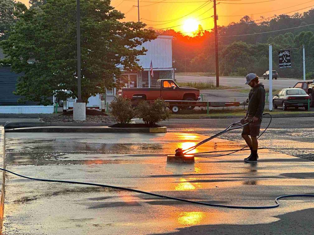 Pressure washing a parking lot 